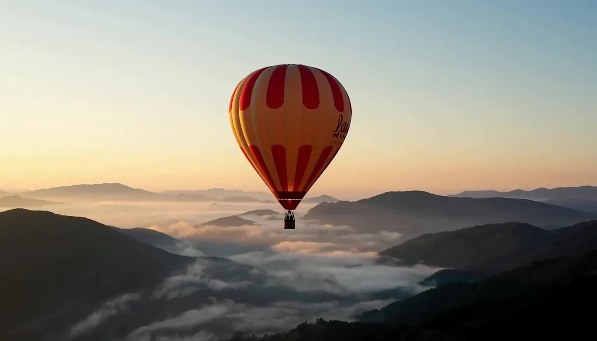 Best AI video models comparison: MiniMax H3 text-to-video frame of a red and cream hot air balloon rising over misty mountains at sunrise