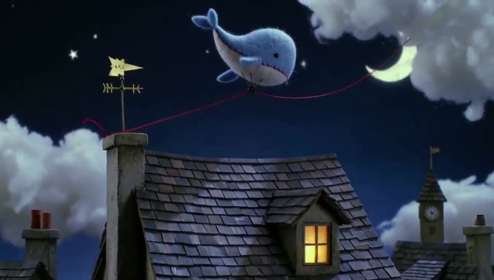 Felt Whale Floating on Night Rooftop