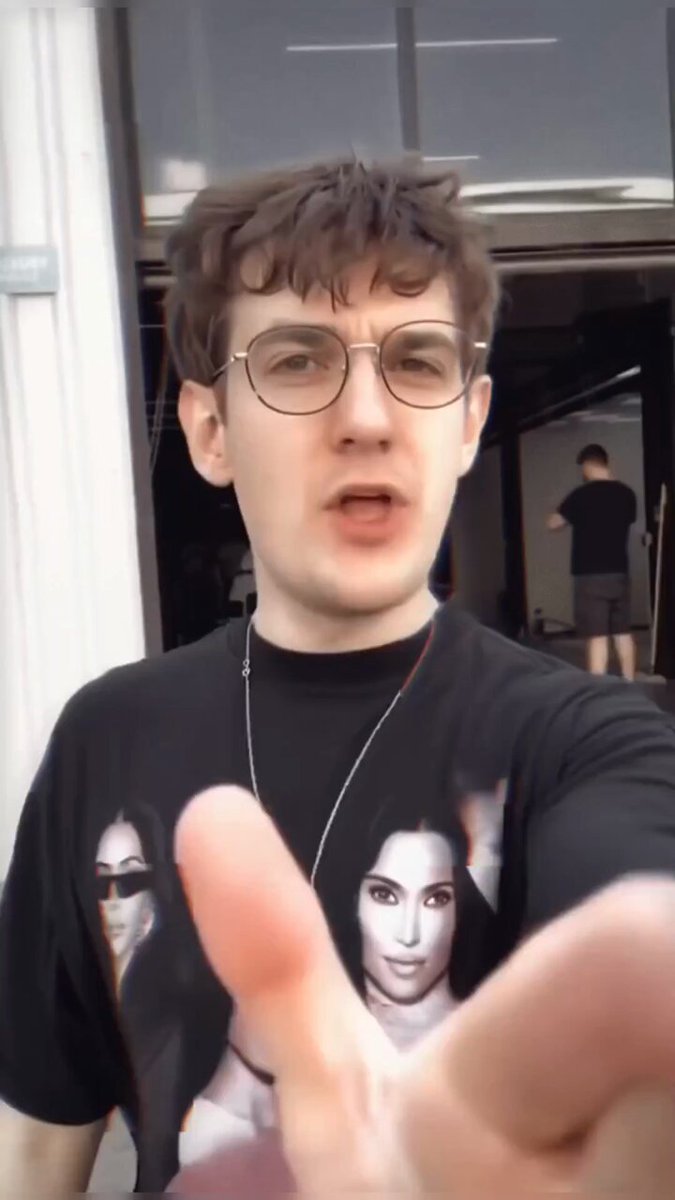 Man Lip-Syncing in Graphic Tee