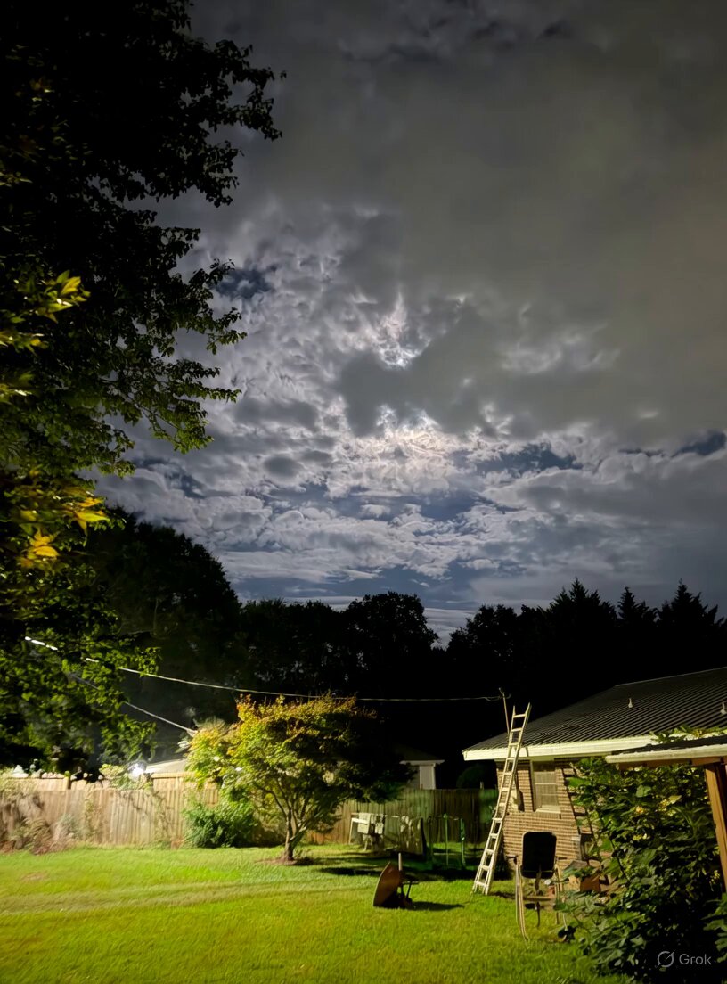 Giant Grok head through clouds