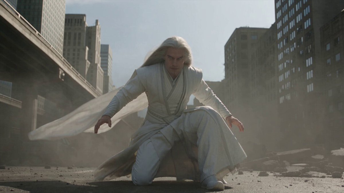 White-haired warrior battles giant monster